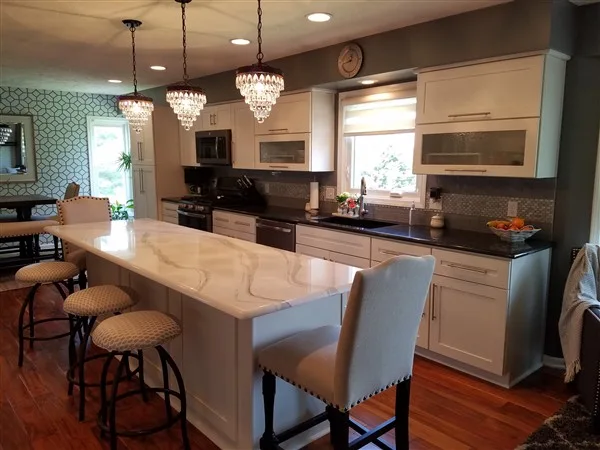 Kitchen with an island, pendant lighting, and custom cabinetry from the original Trish B Designs site.
