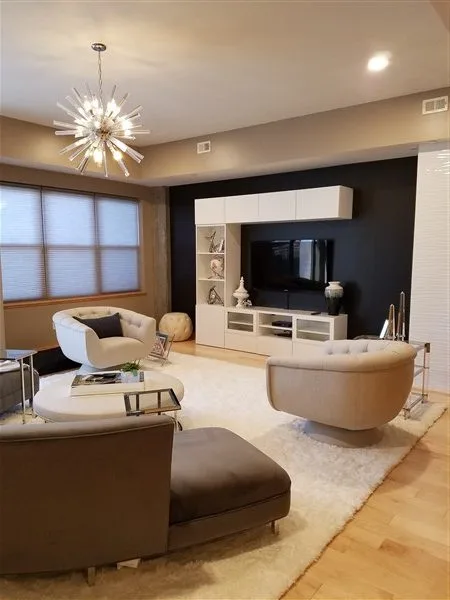 Living room with coordinated seating, a fireplace, and window treatments from the original Trish B Designs site.